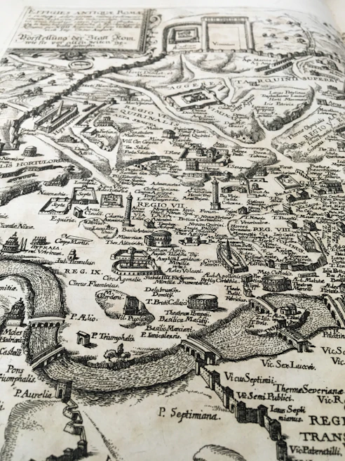 A detailed map of Mohenjo-daro city layout with terracotta clay and antique gold highlights