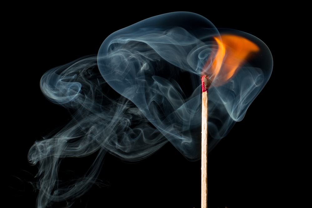 burning stick with smoke