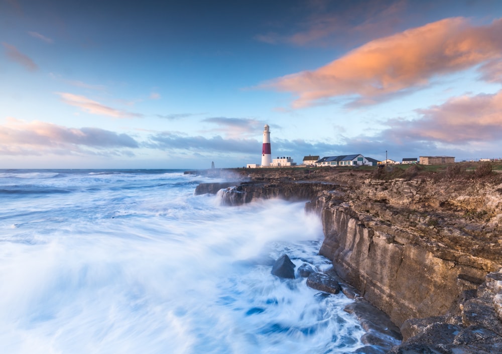 lighthouse near sea during daytime