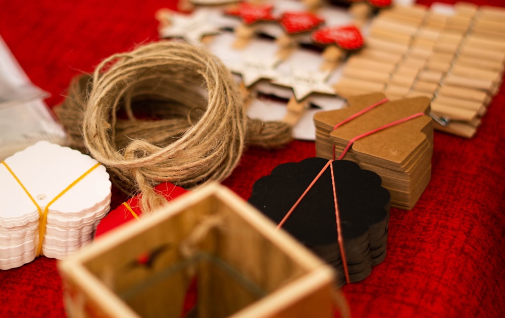 assorted art crafts on red textile