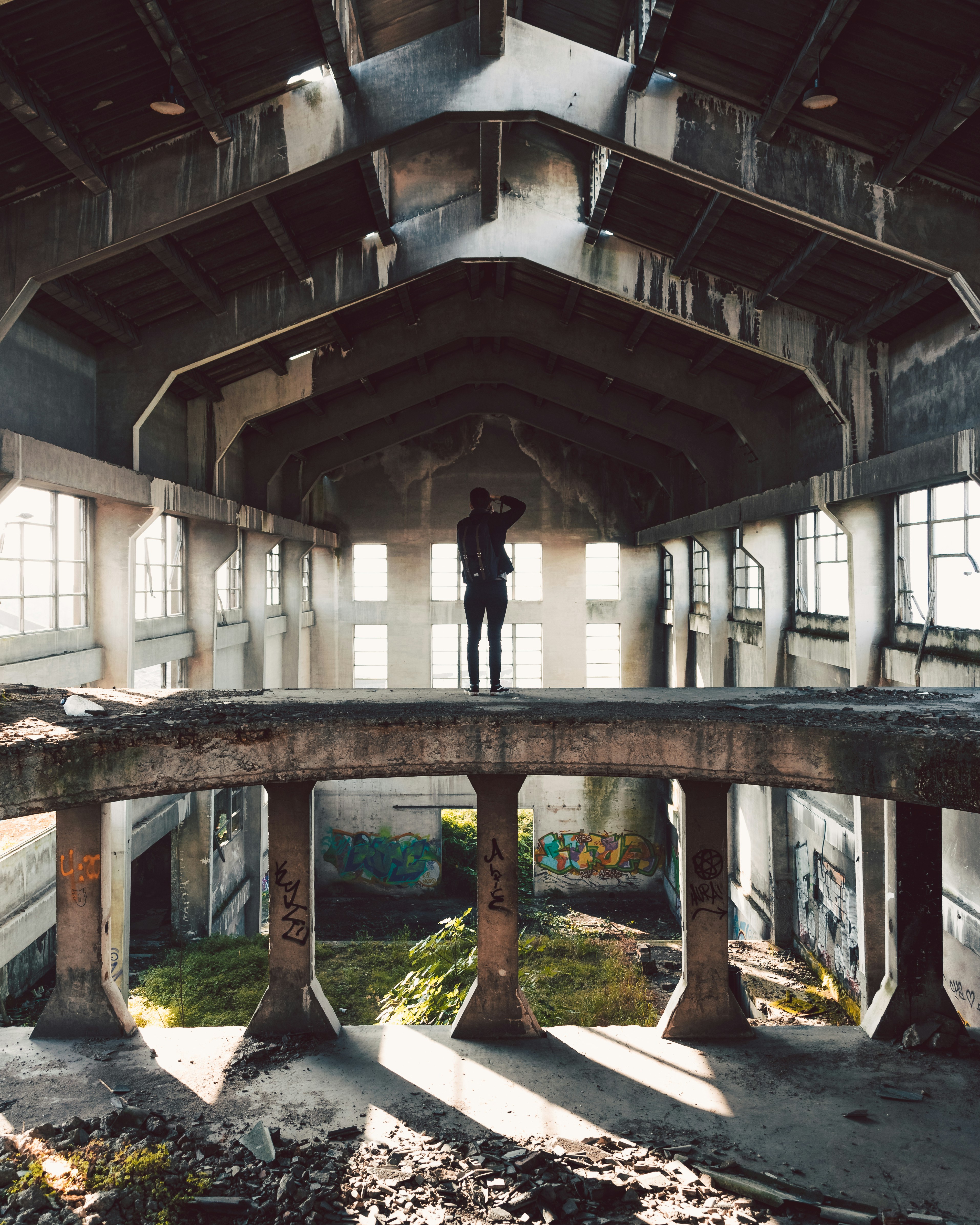 man standing on abandon house