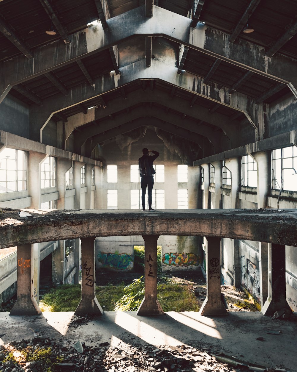 man standing on abandon house