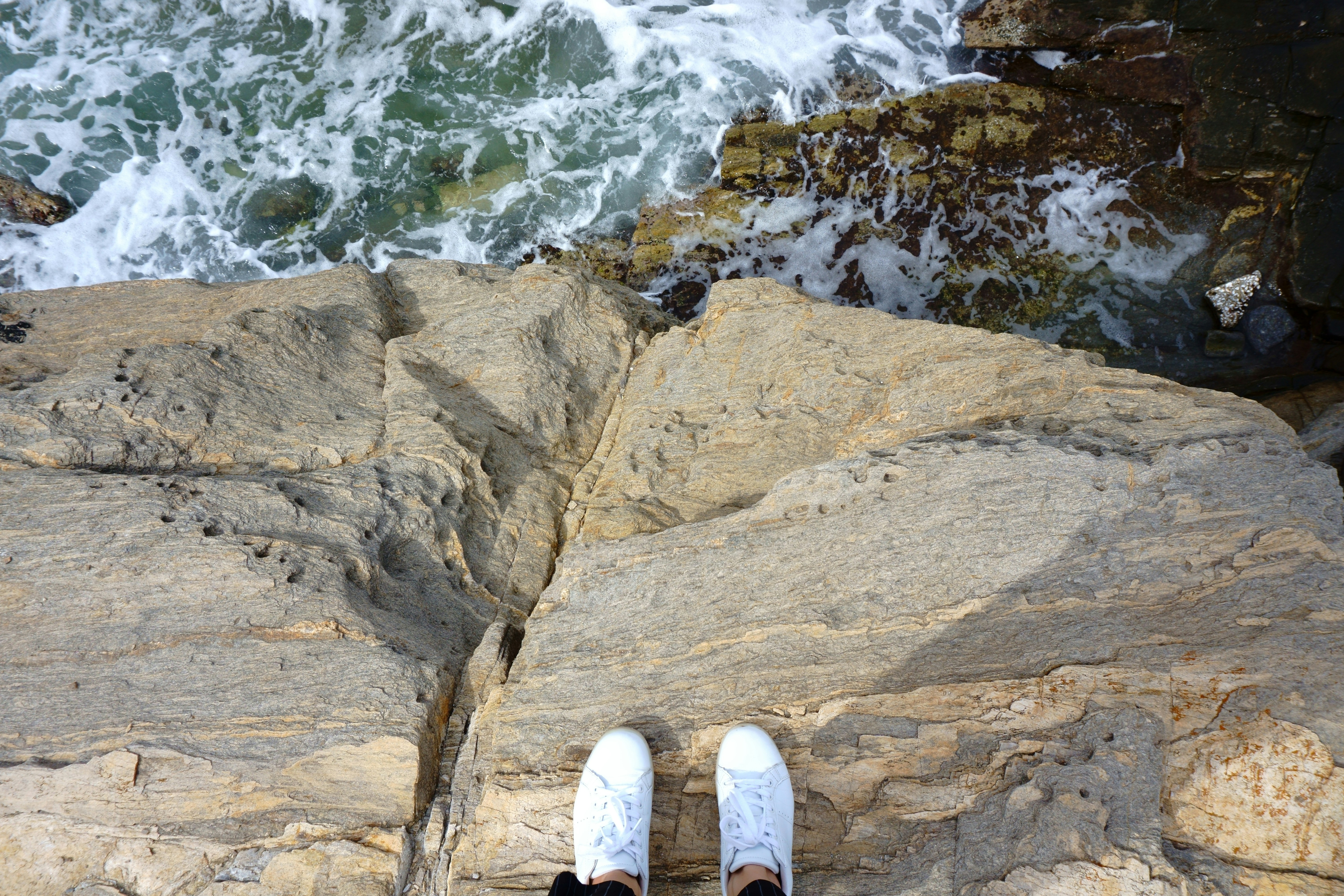 person standing on rock, Sea view on Paros, Greece
