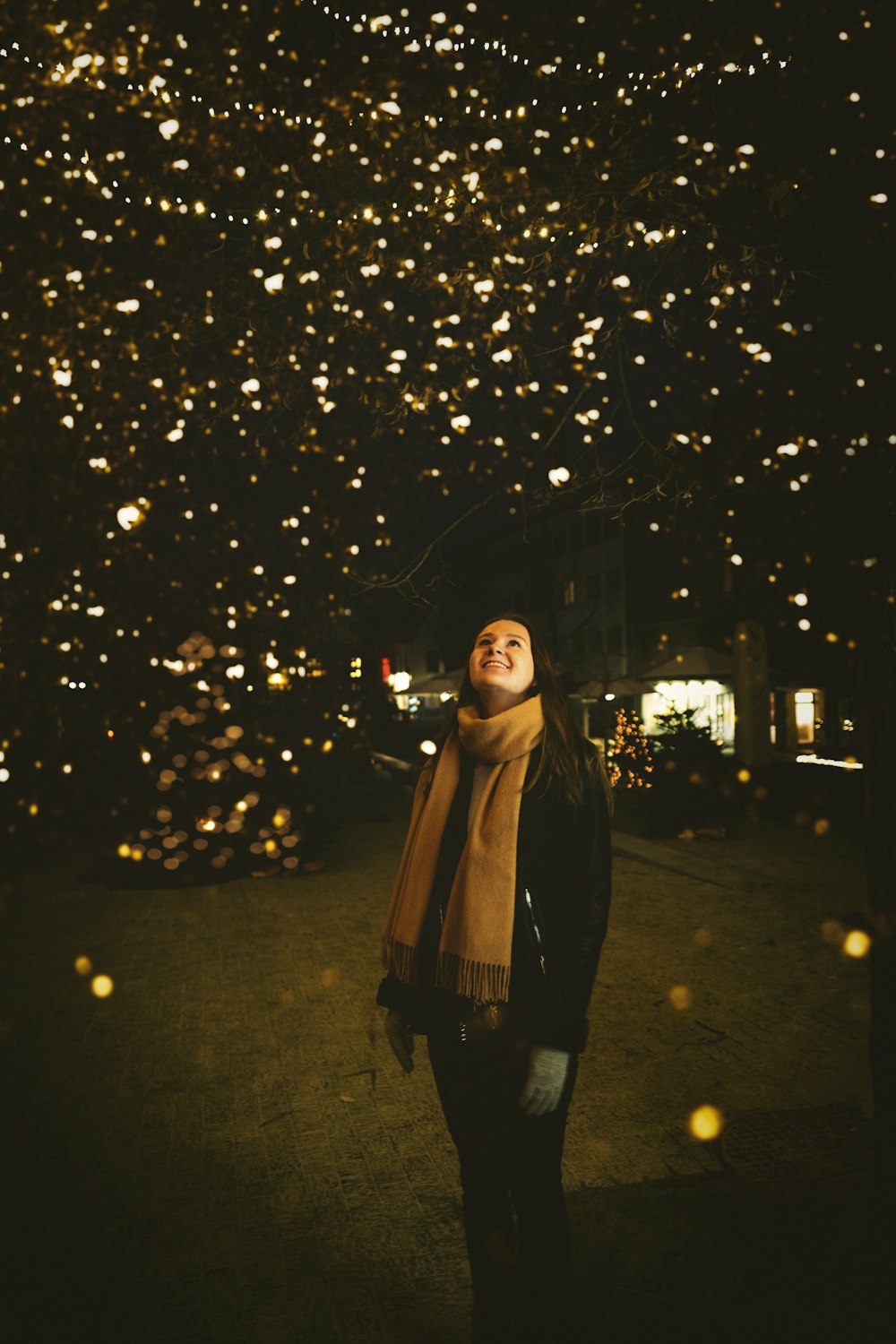 woman looking above a dark sky