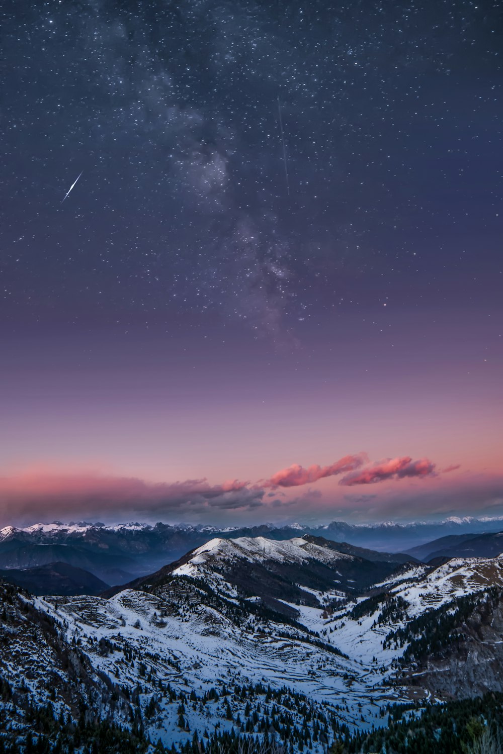 snowy mountain during nighttime