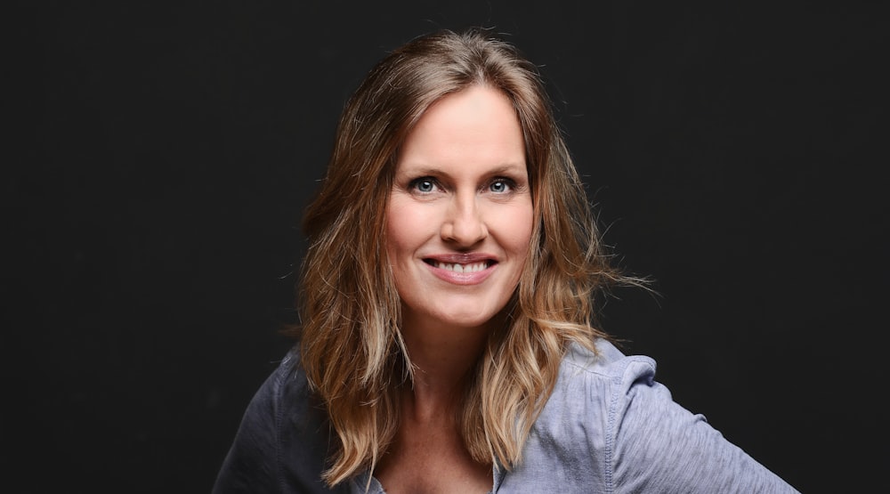 woman smiling with black background