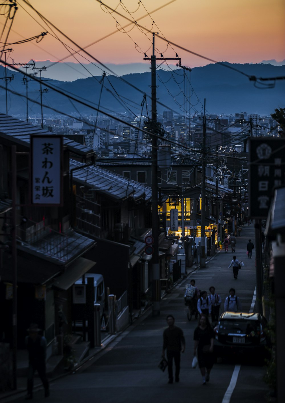 aerial view photography of people walking between house