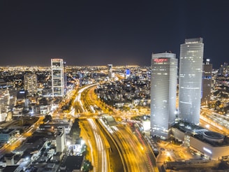 time-lapse photography of moving vehicles on road