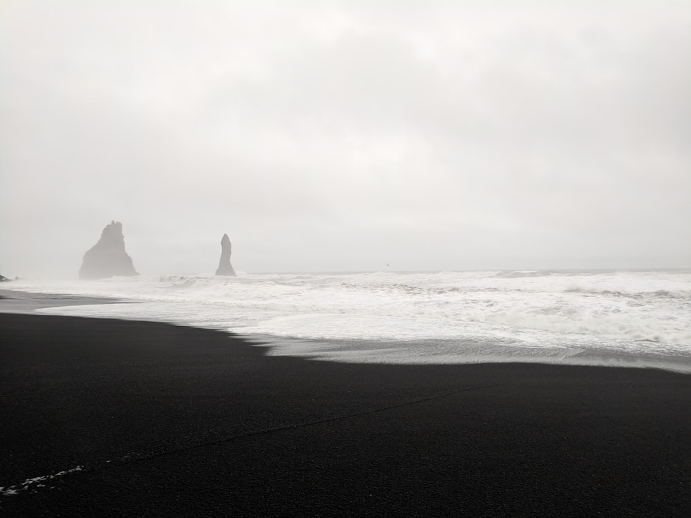 silhouette of sea stacks during daytime