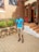 A satisfied customer standing next to a newly paved driveway.