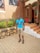 A smiling man standing outside a transitional care housing facility.