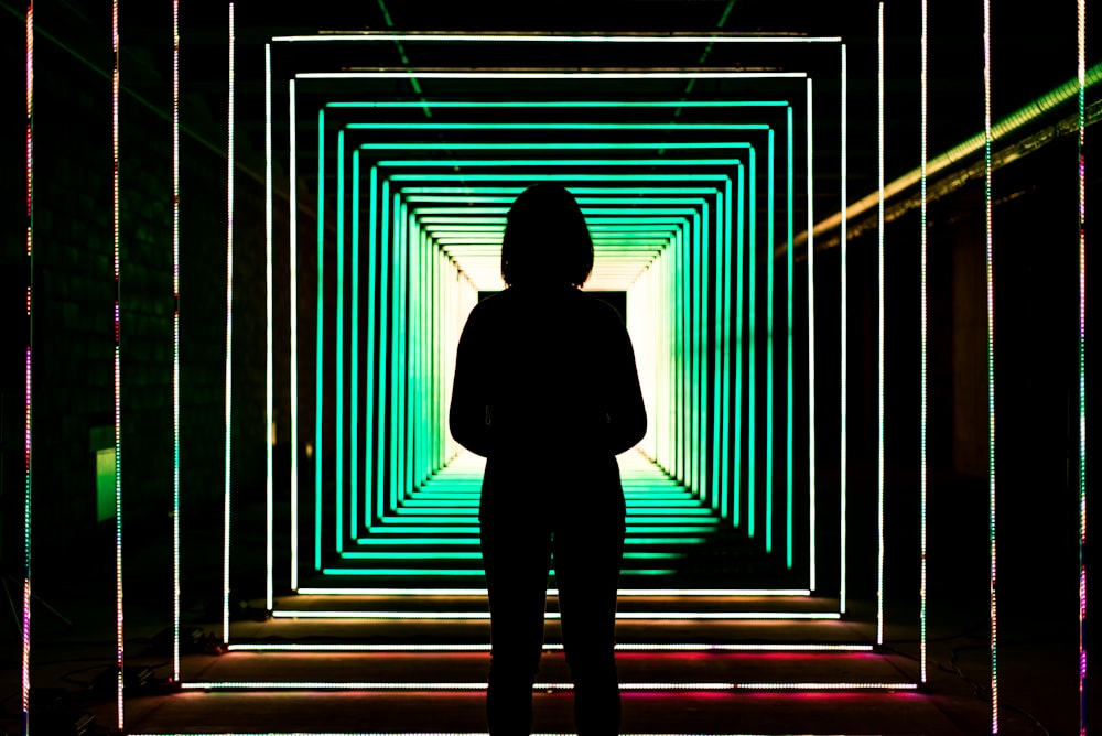 standing woman inside dark room