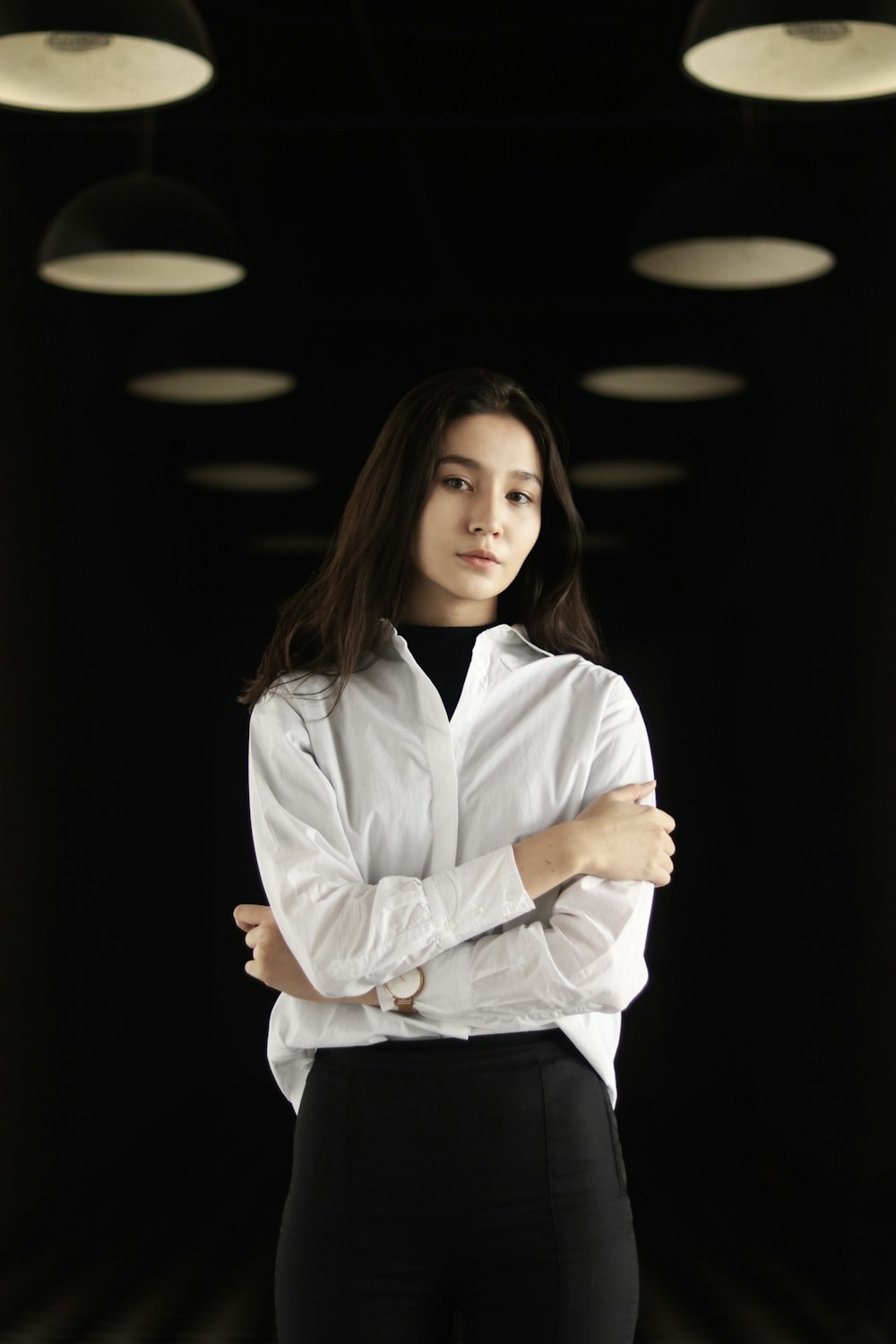 woman wearing white blouse and black miniskirt