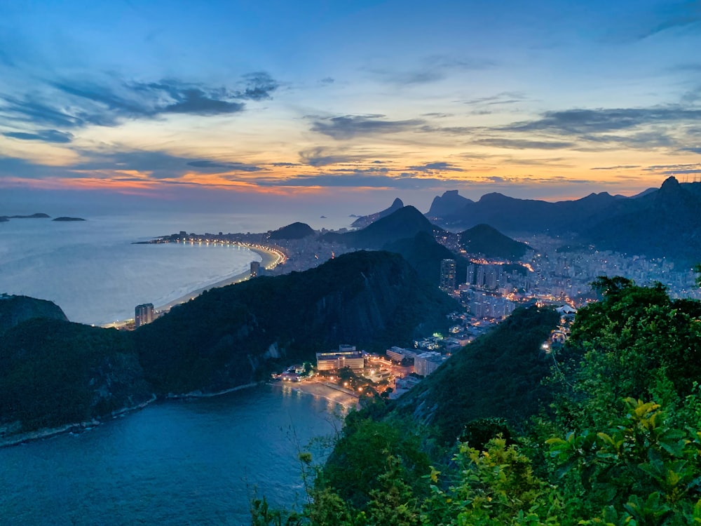 aerial photography of mountains surrounded by sea