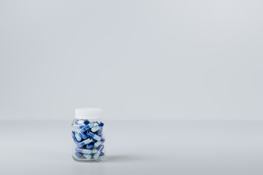 blue and white tablet in container