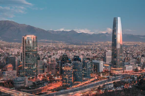 Panoramic view of Monterrey's modern skyline framed by surrounding mountains.