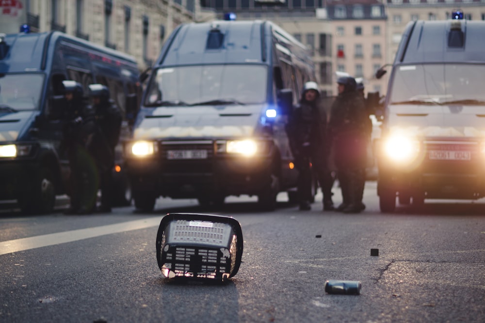 shallow focus photo of black radio on road near cars