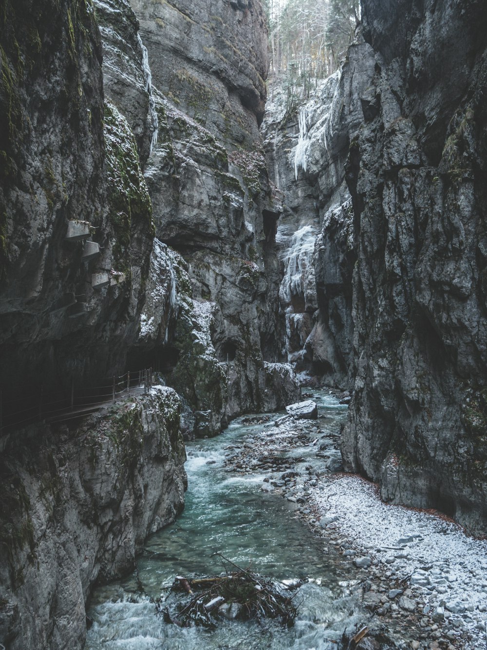 river surrounded by rock formation during daytime