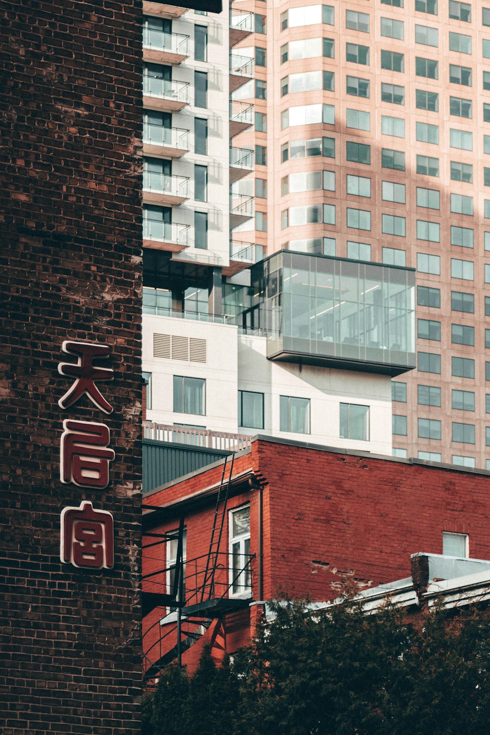 red painted building beside white building