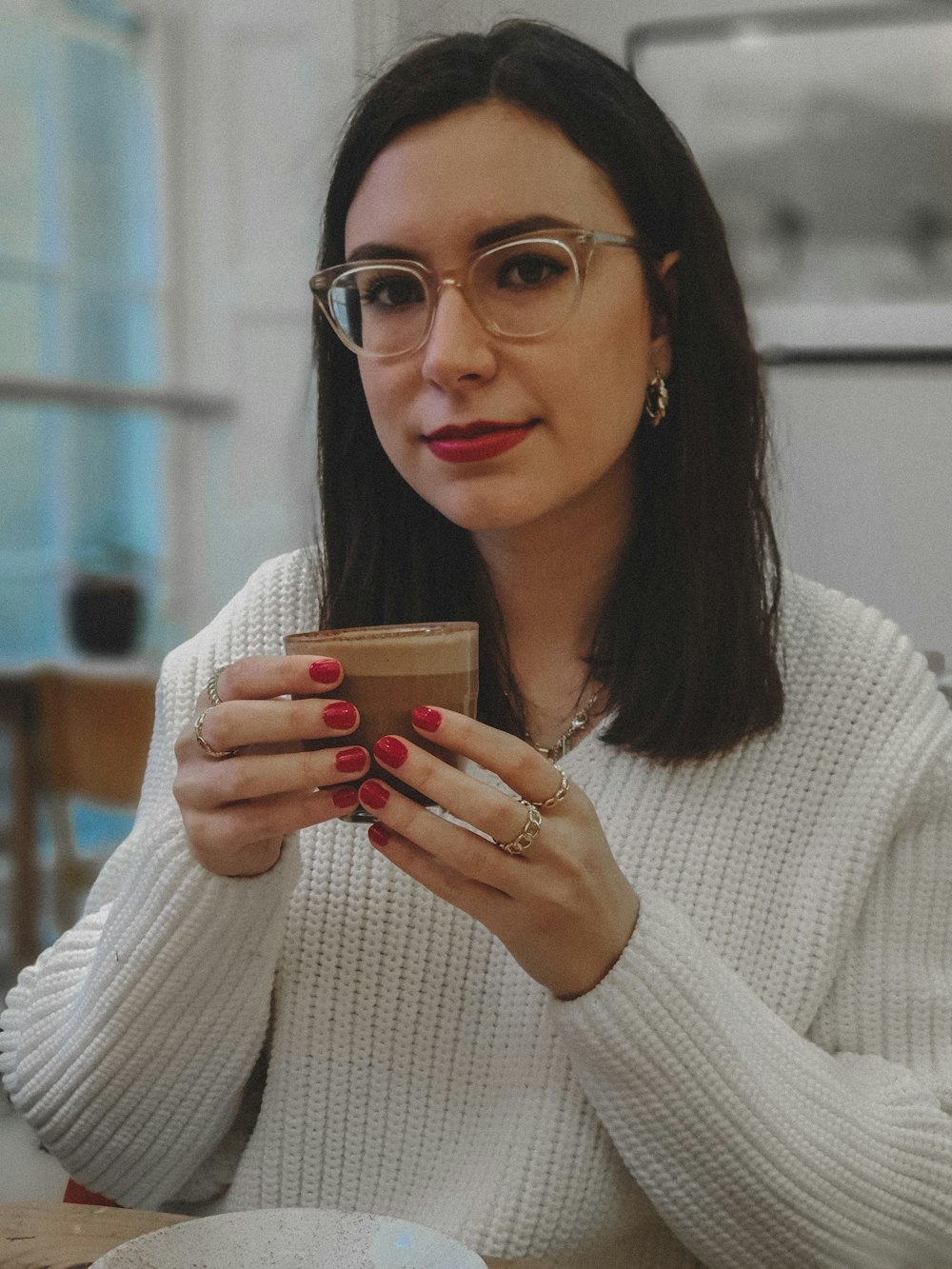 woman holding teacup