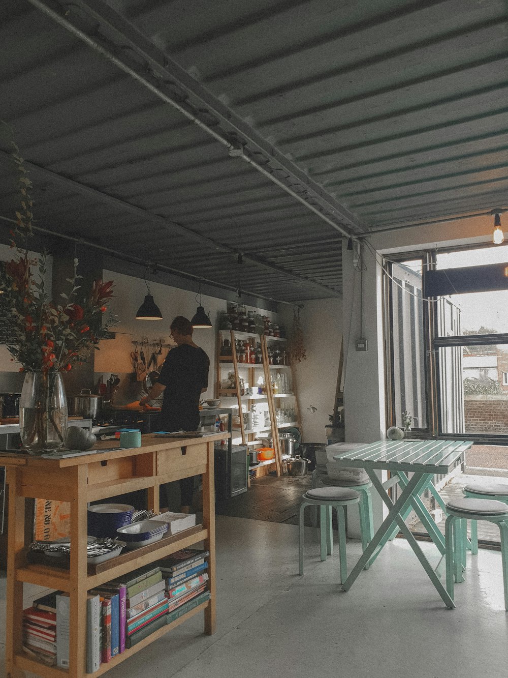 man cooking in the kitchen during daytime