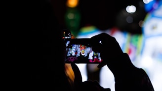 silhouette of person using smartphone