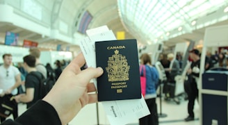person holding Canada passport