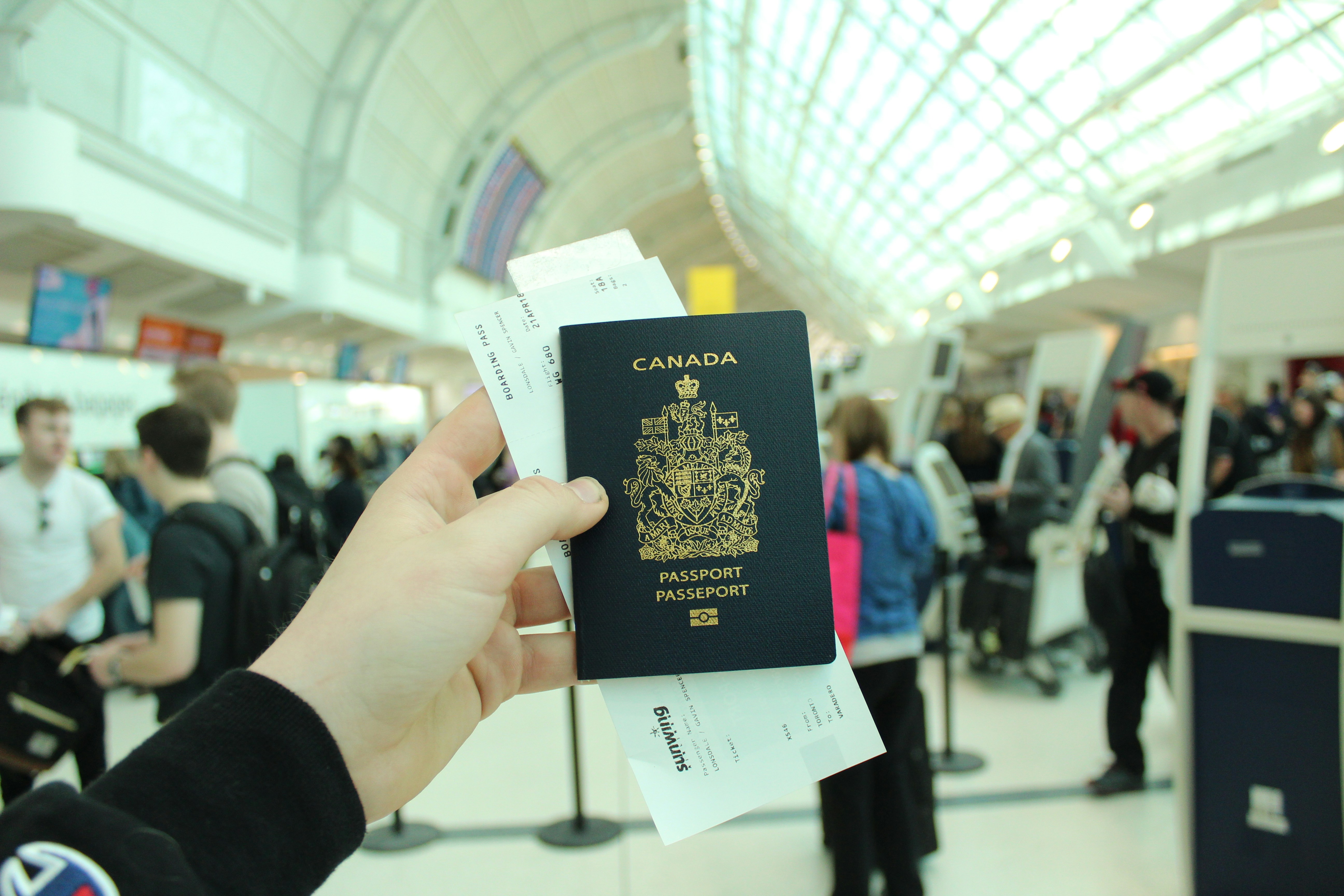 Traveler holding a Canada passport