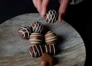 person holding chocolate ball