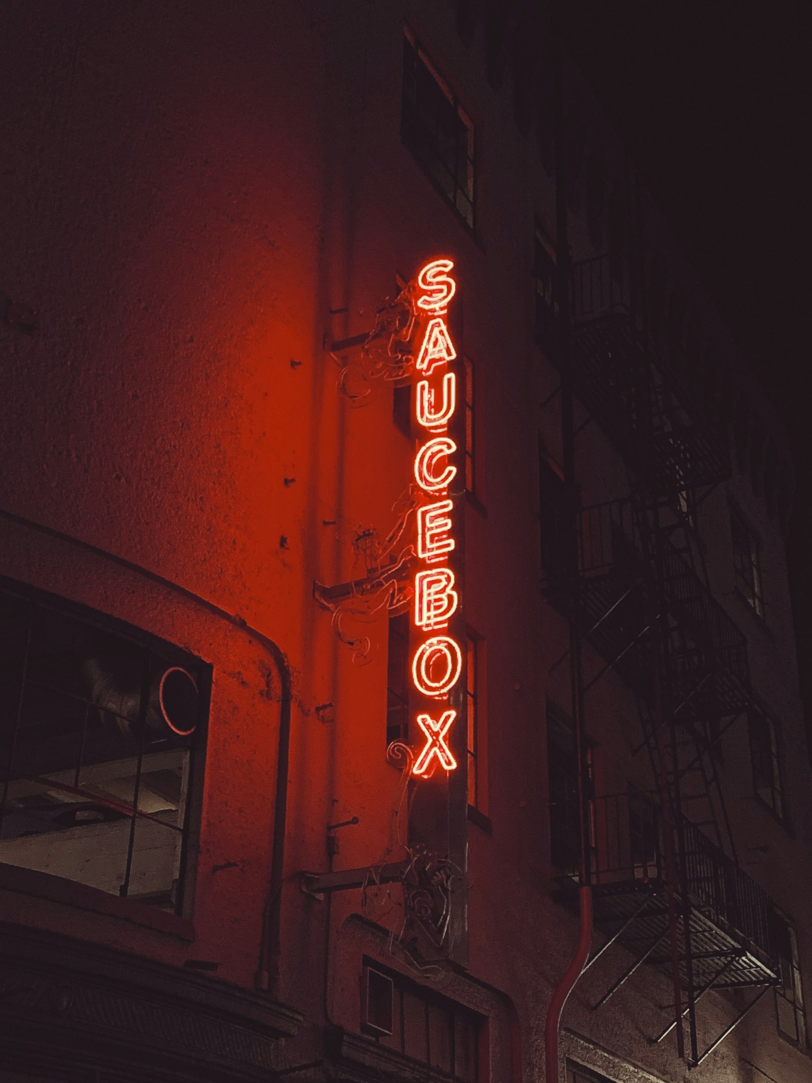 Apple iPhone XS sample photo. Saucebox lighted signage during photography