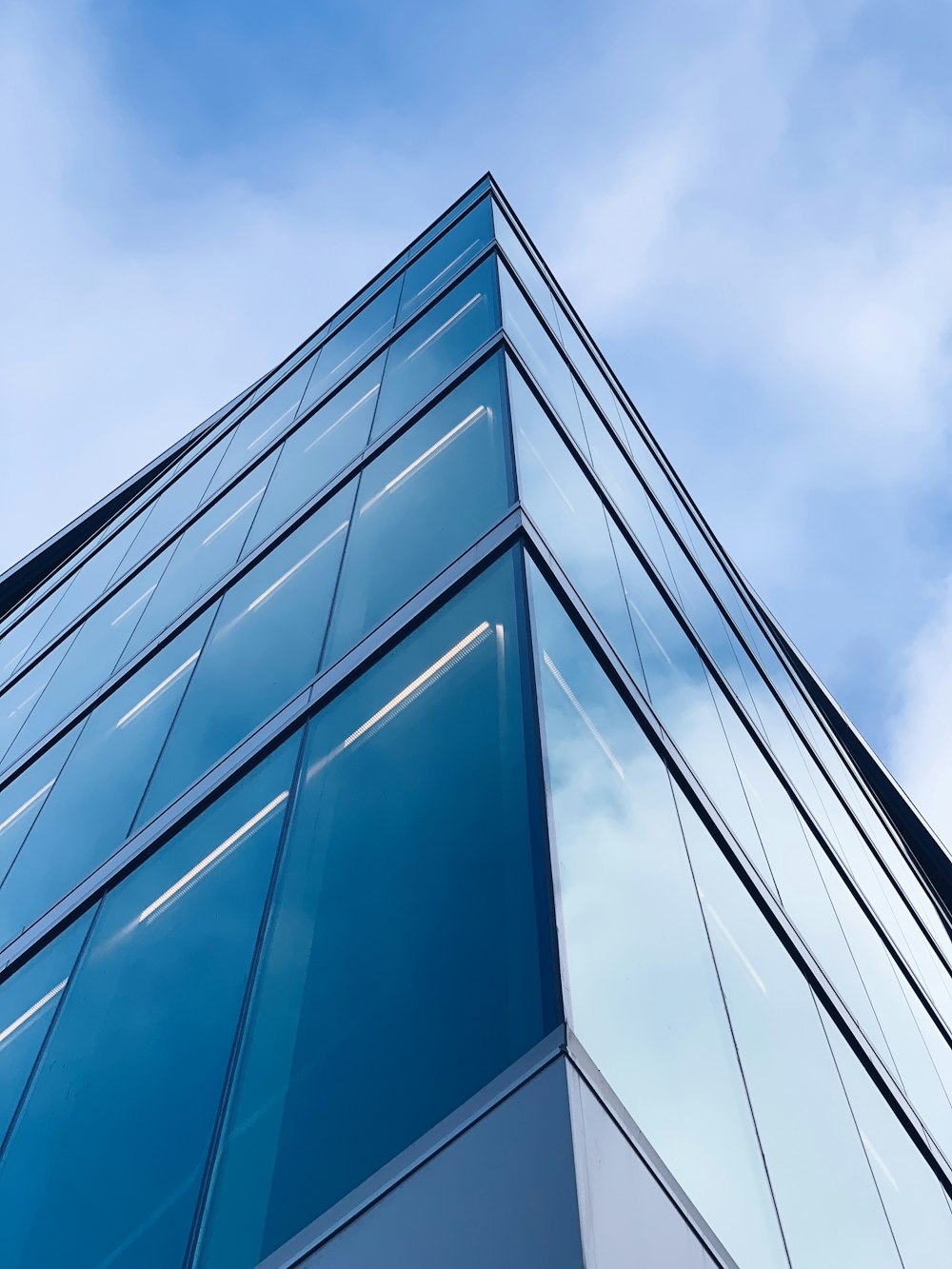 low angle photography of glass building