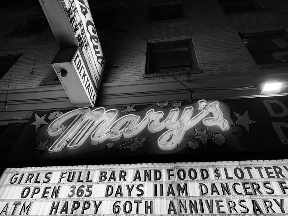 grayscale photo of Mary's lighted signage