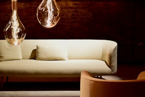 A stylish living room featuring modern lighting fixtures.