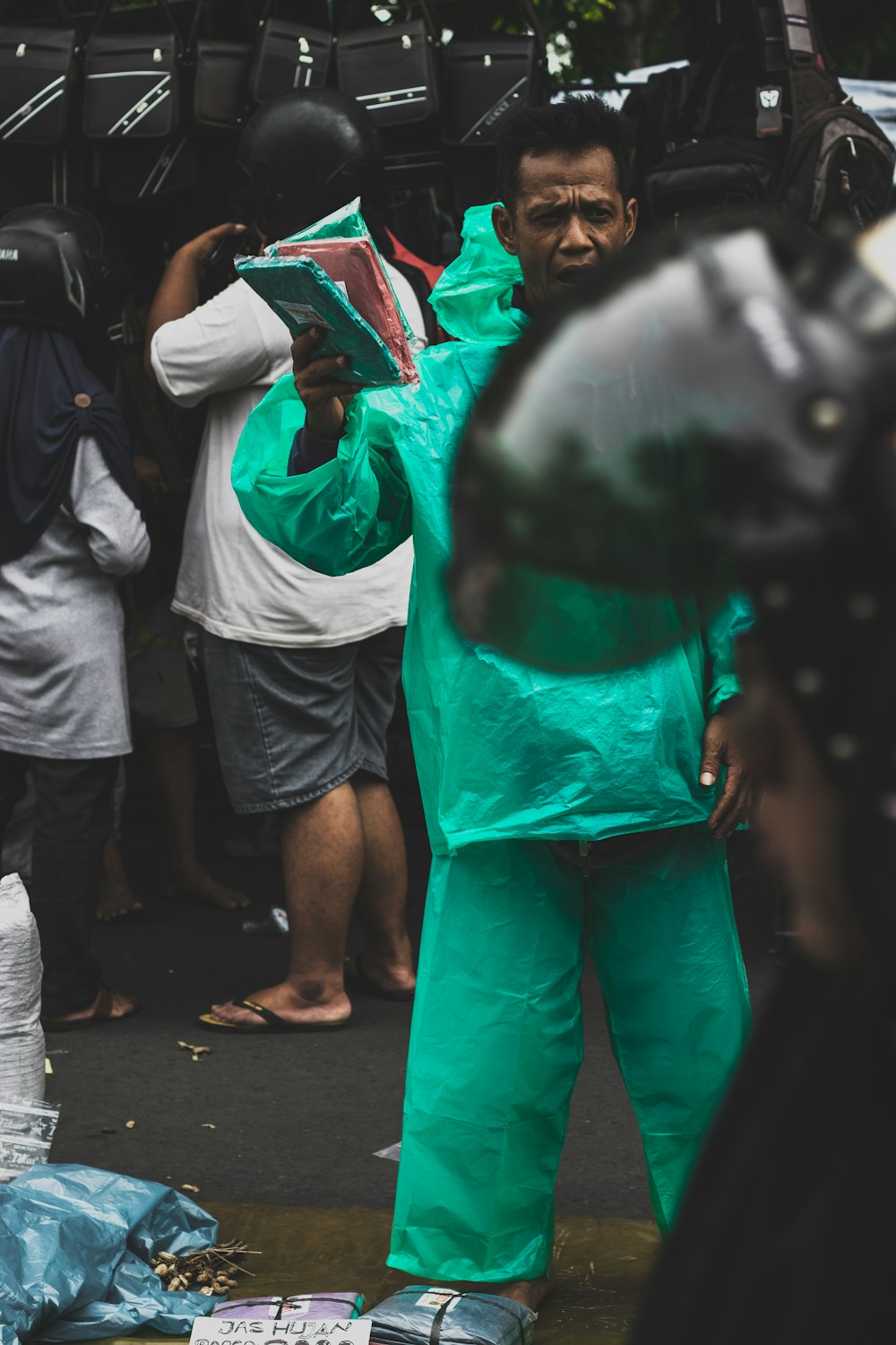 man wearing green windbreaker jacket