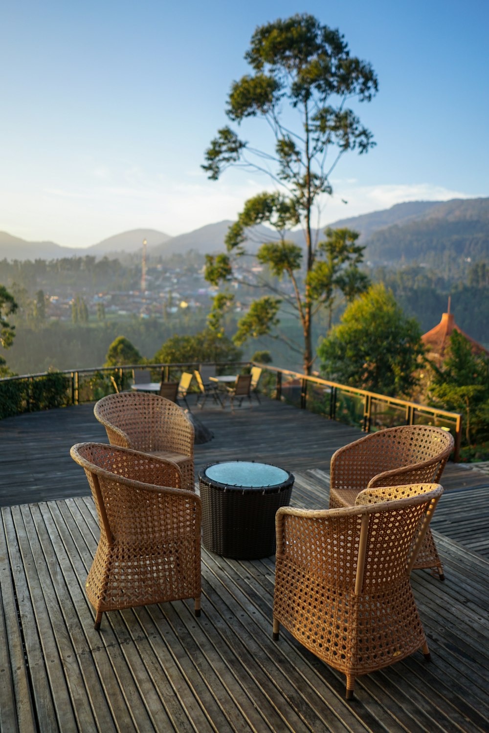 four brown wicker chairs