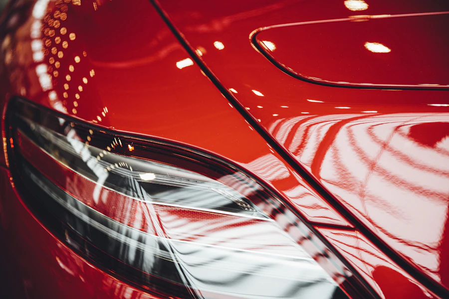 Glossy red sports car detail close-up