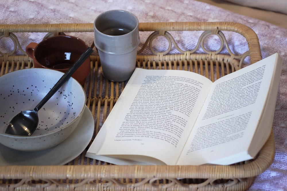 white book on brown wicker tray