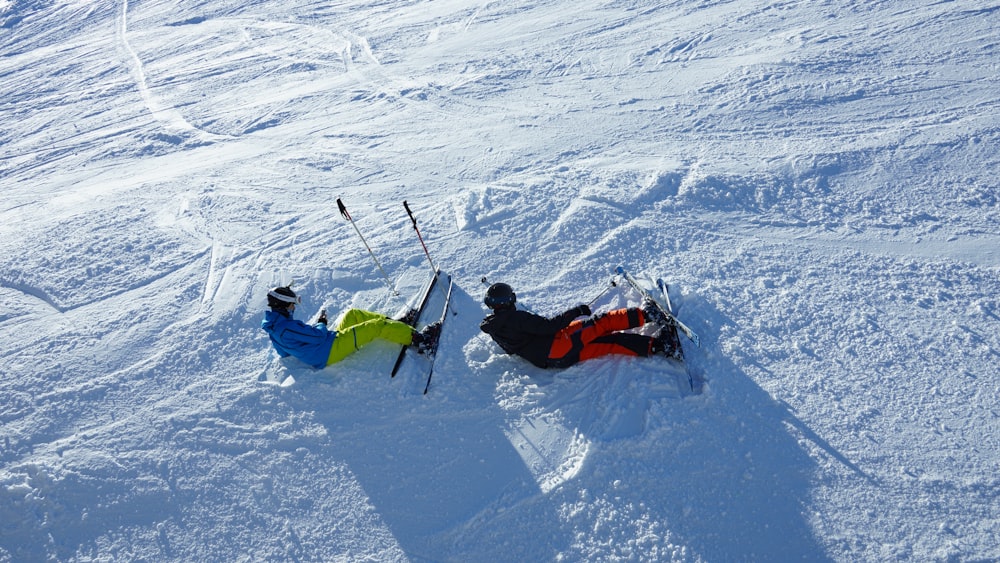 two men playing skis on field