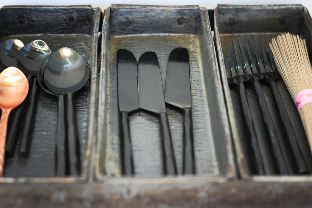 black wooden utensil trays