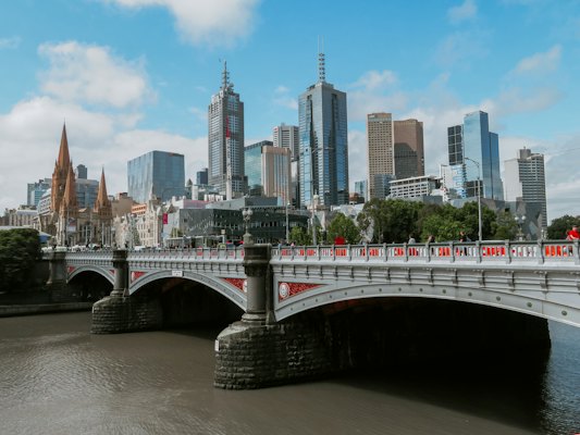 White bridge across city buildings — Melbourne, Australia