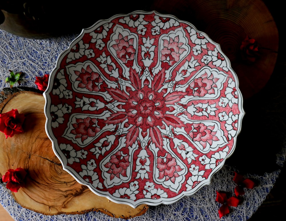 red and white floral ceramic plate
