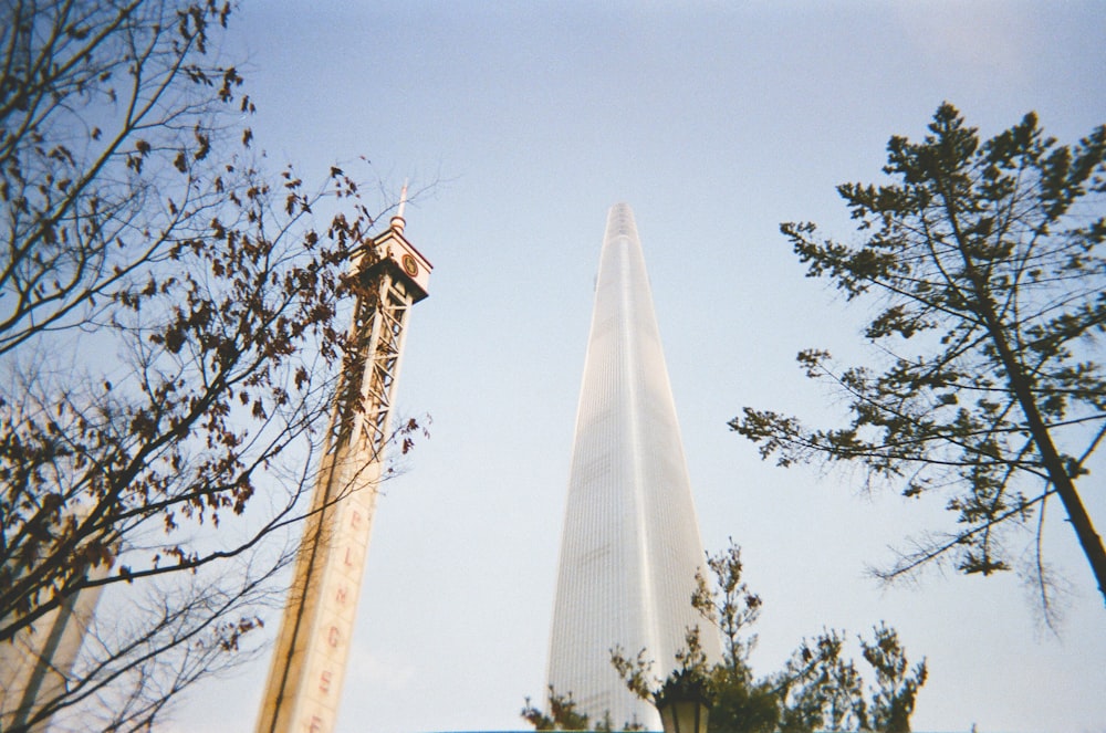 low-angle view of high-rise building under blue sky during daytime