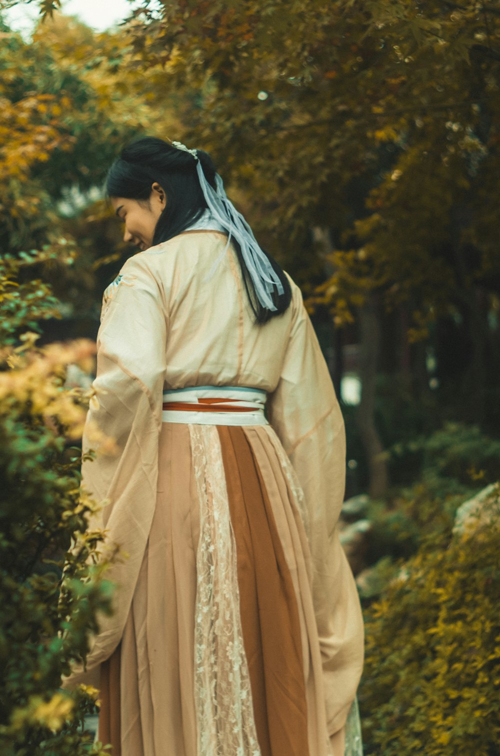 woman standing near trees during daytime