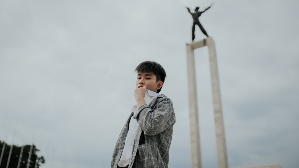 man standing near tower