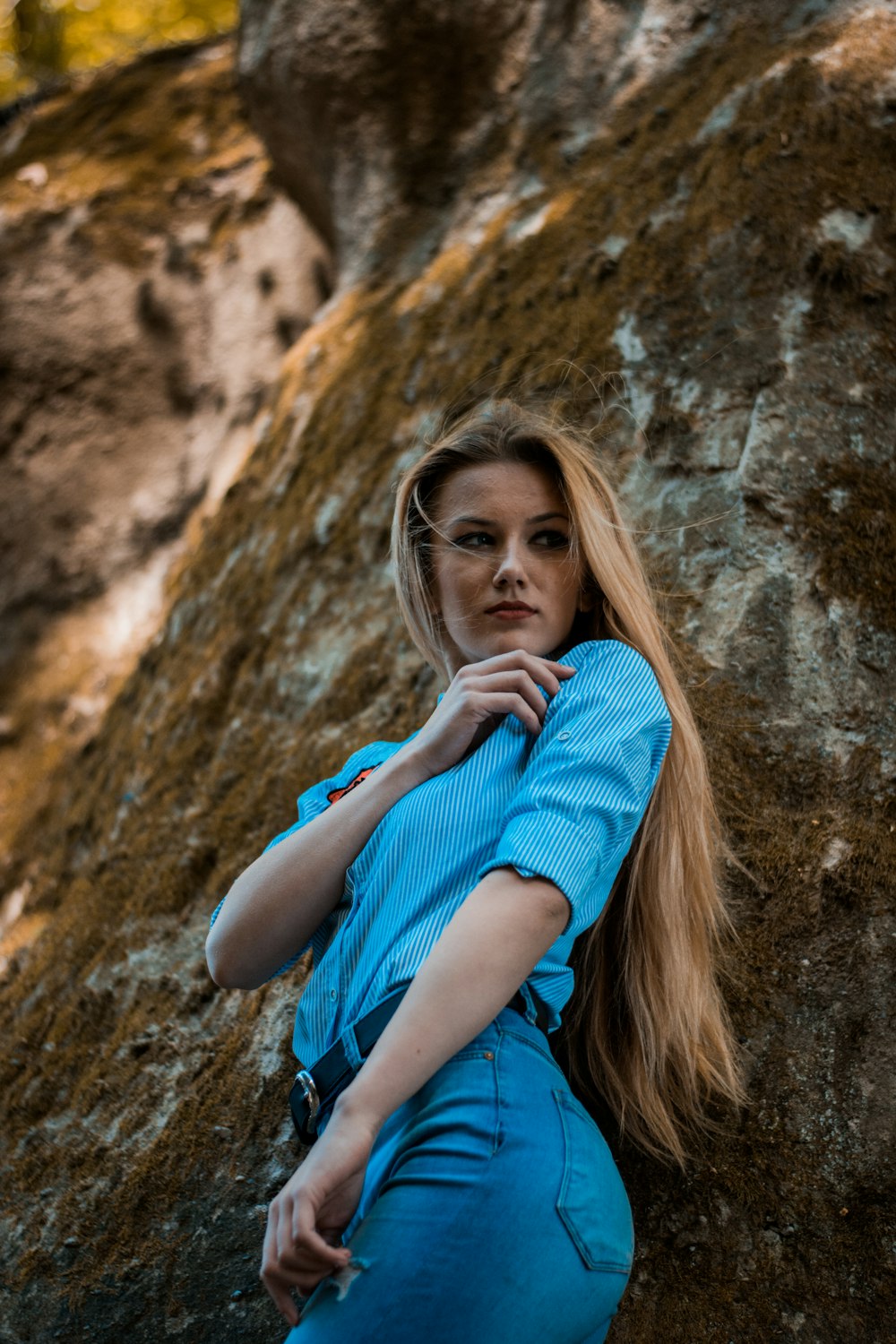 woman standing near rock formation