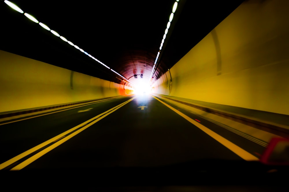 timelapse photography of vehicle inside tunnel