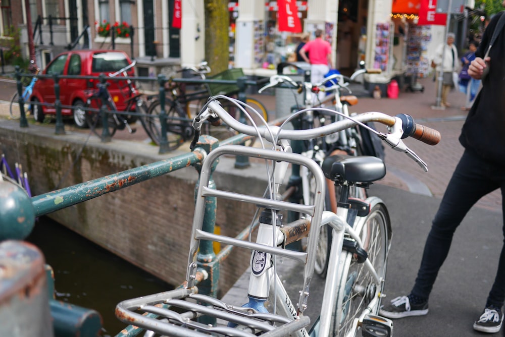 bicycles park beside railings during daytime