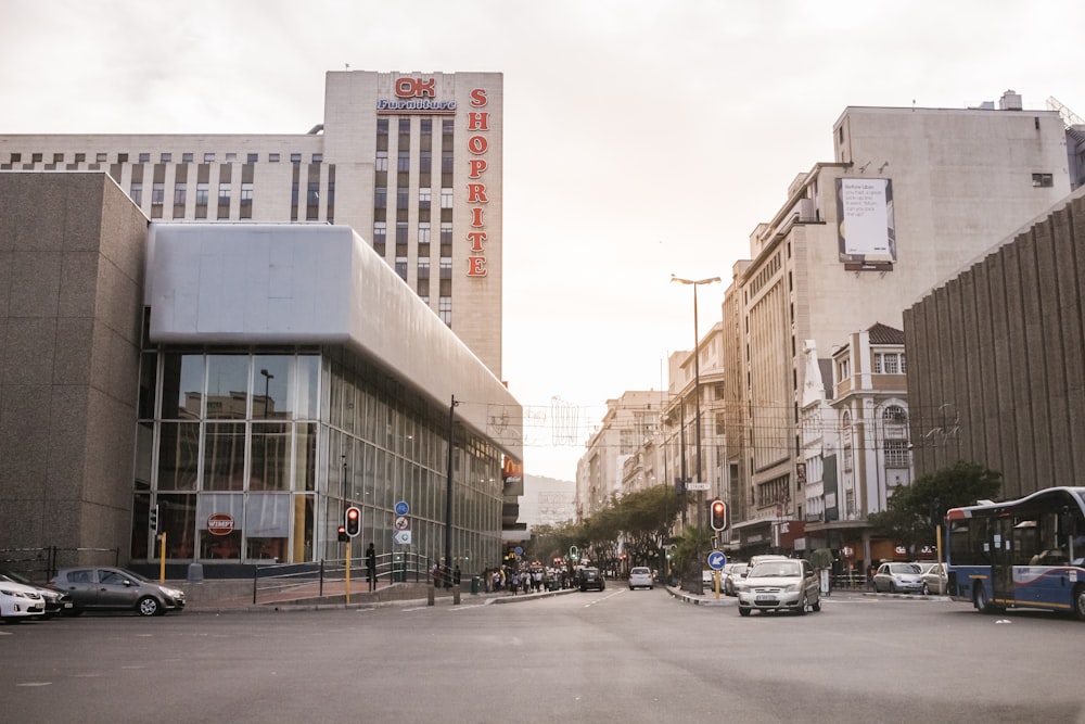 vehicles on street between buildings