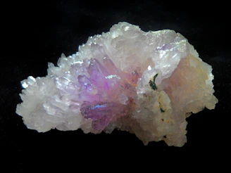 A cluster of shimmering crystals glowing under moonlight