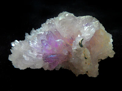 A cluster of shimmering crystals glowing under moonlight